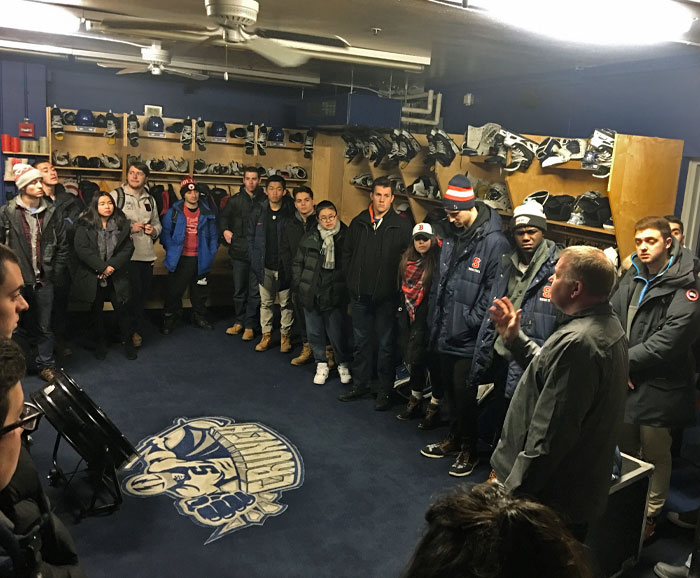 SPM Students meet with the Syracuse Crunch team in a locker room