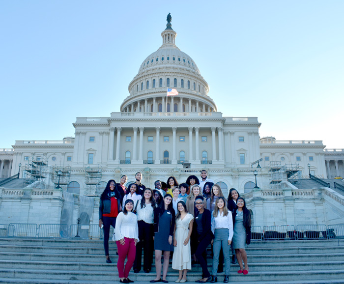 Students standing in front of the Capitol Building