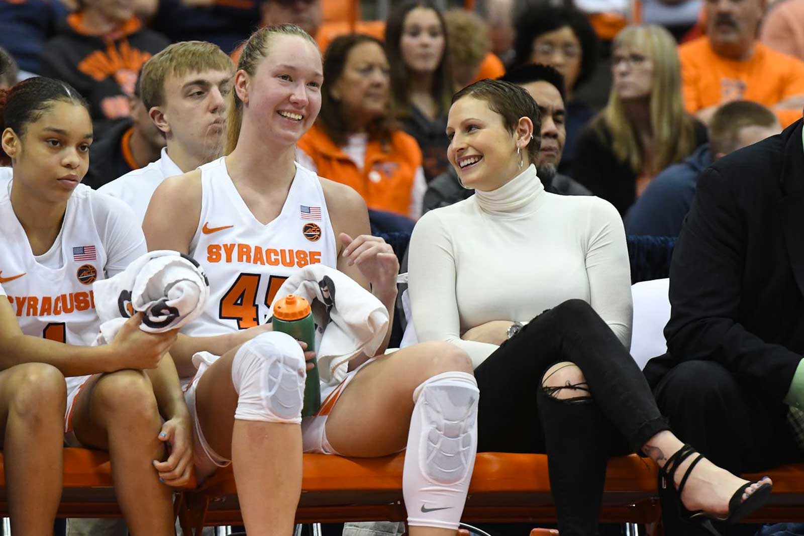 players are sitting together on a bench during a game