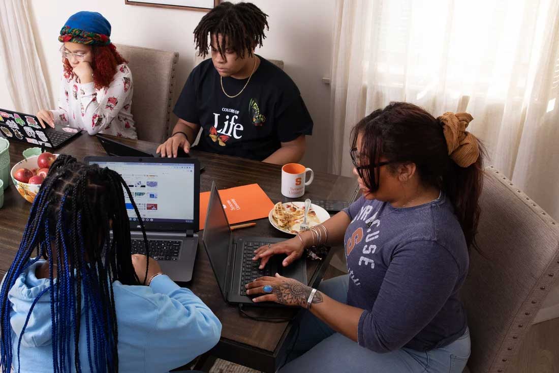 ashlee at a table with three other children