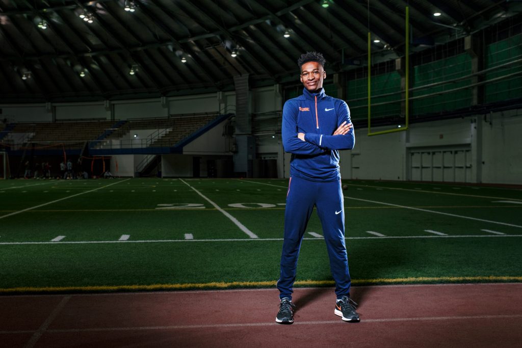 Justyn Knight stands in a field