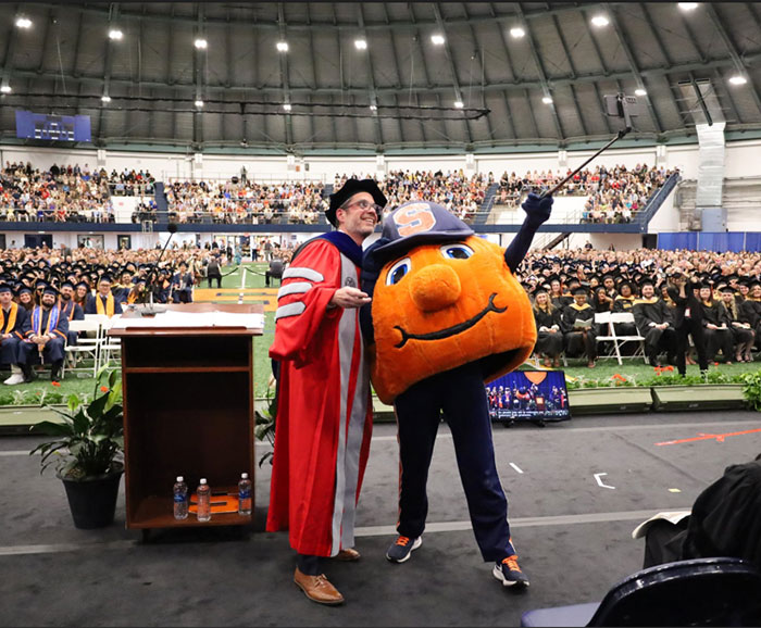 Dean Jordan and Otto standing together at Falk 2025 Convocation ceremony