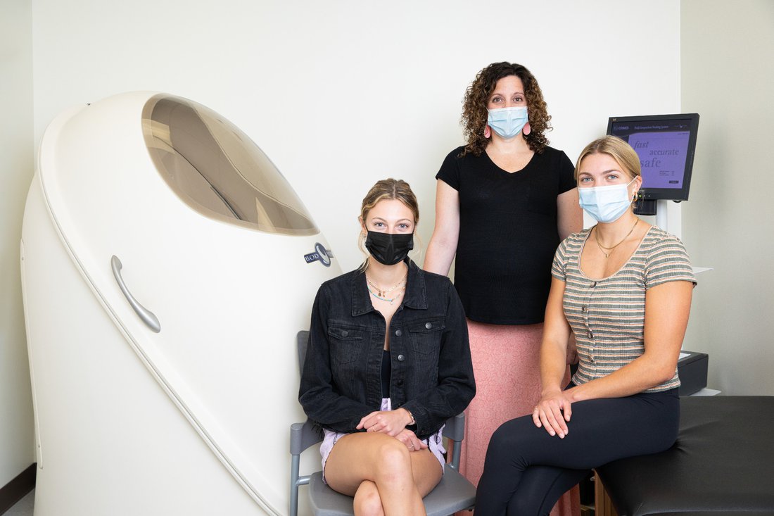 Portrait of Samantha Jezak, Olivia Templeton and Professor Jessica Garay in their research lab.