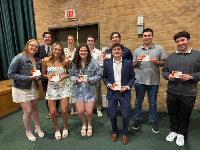 Student award winners standing together in front of Grant Auditorium