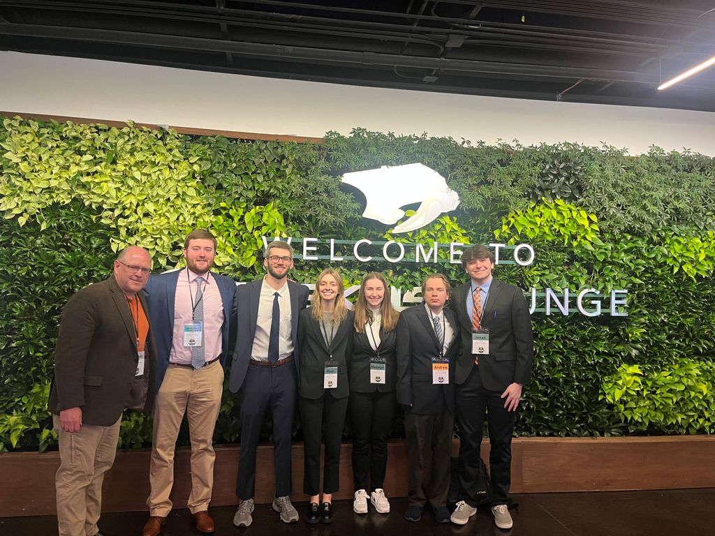 Syracuse group standing together at AXS National Collegiate Sports Analytics Championship