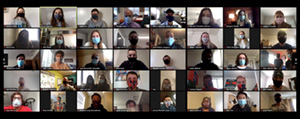 Multiple persons are in a Zoom session with masks on