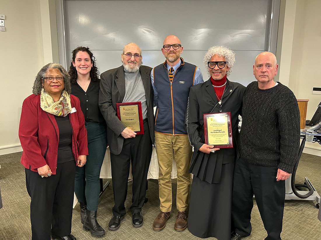 Group of Social Justice Award winners standing in front of a classroom